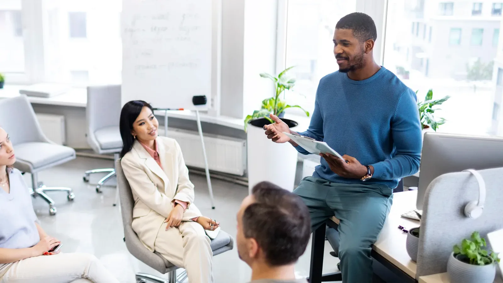 A team engaged in a training session led by a colleague